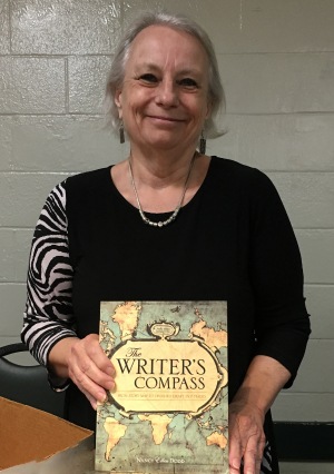 Nancy Ellen Dodd with her book, The Writer's Compass
